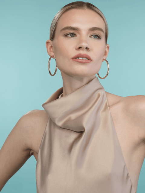 romare gold hoop earrings worn on model